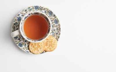 High angle view of tea cup against white background