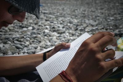 Cropped image of woman reading book