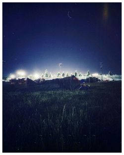 Scenic view of field against sky at night