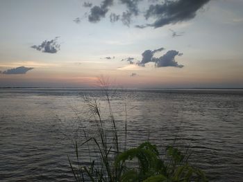 Scenic view of sea against sky during sunset