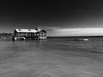 Boats in sea against sky