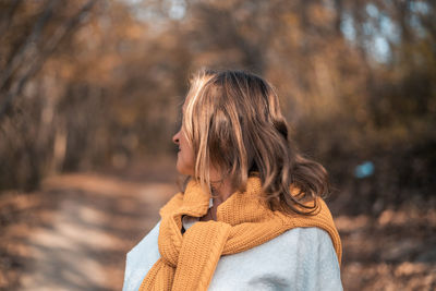 Woman standing in snow covered land