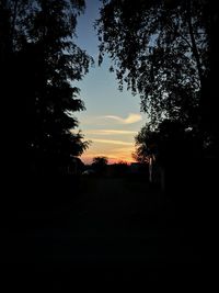 Silhouette of trees against sky at sunset