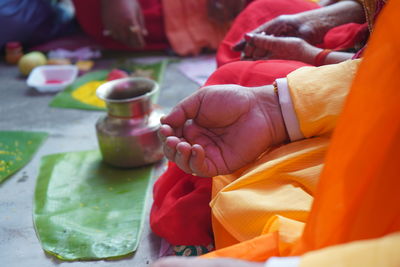 Midsection of woman during traditional ceremony