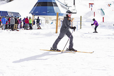 People skiing on snowcapped mountain