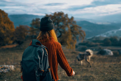 Rear view of man standing on land