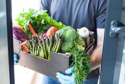 Man holding vegetables