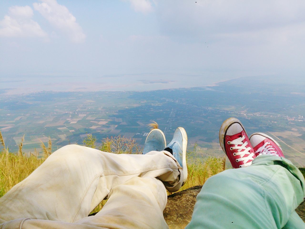 low section, lifestyles, person, leisure activity, personal perspective, men, relaxation, sitting, shoe, togetherness, resting, relaxing, sky, human foot, landscape