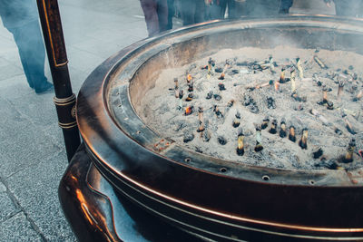 High angle view of person preparing food in street