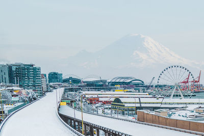 View of city and mountain during winter