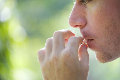 Close-up of man eating food