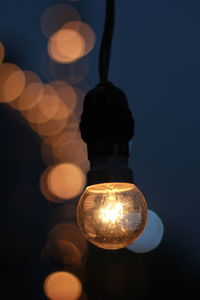 Close-up of illuminated light bulb