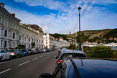 Cars on road against sky