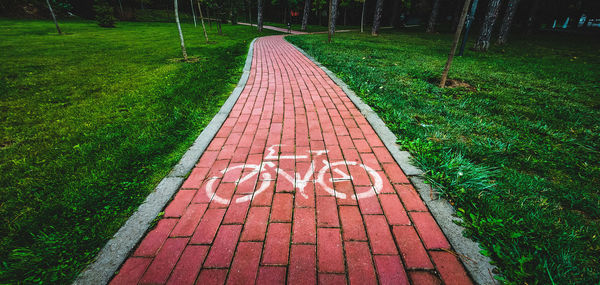 High angle view of text on footpath in park
