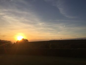 Scenic view of silhouette landscape against sky during sunset