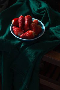 There are some delicious sweet and sour fresh strawberries on the plate