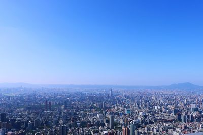 High angle view of illuminated cityscape against sky