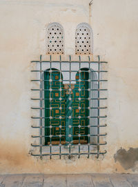 Low angle view of window on wall of building