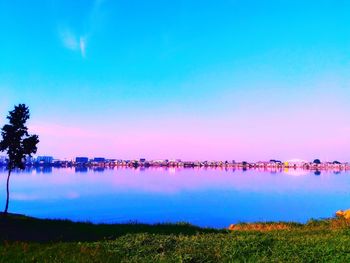 Scenic view of lake against blue sky