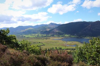 Scenic view of landscape and mountains against sky