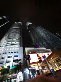 Low angle view of illuminated buildings at night