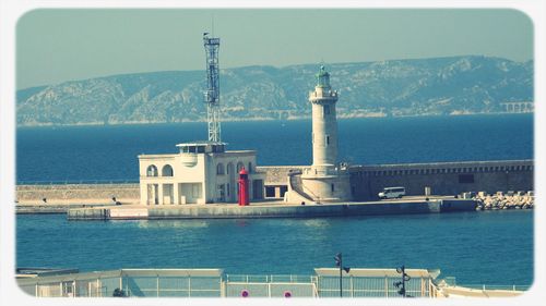 View of sea with mountain range in background