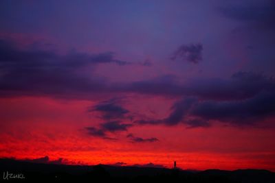 Silhouette of landscape against dramatic sky