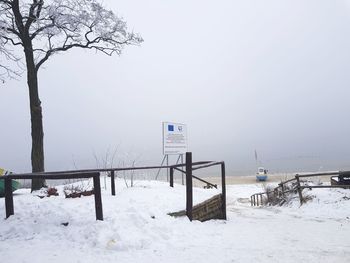 Snow covered landscape against clear sky