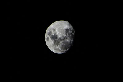 Low angle view of moon against sky at night