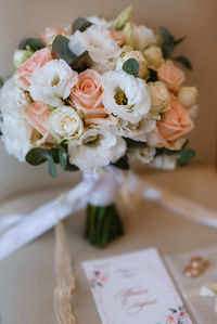 Cropped hand of woman holding bouquet