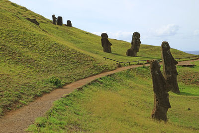 Walking route among the legendary giant moai statues at rano raraku volcano on easter island, chile