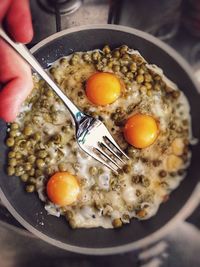 Close-up of man holding breakfast
