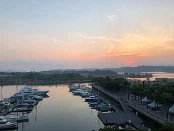 High angle view of harbor against sky during sunset