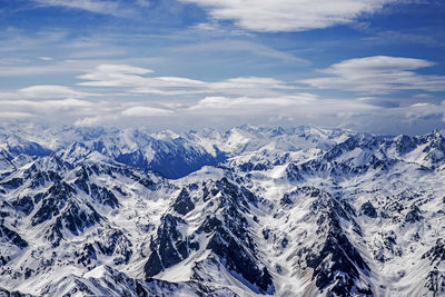 Scenic view of snowcapped mountains against sky