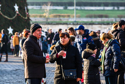 People standing on street in city during winter