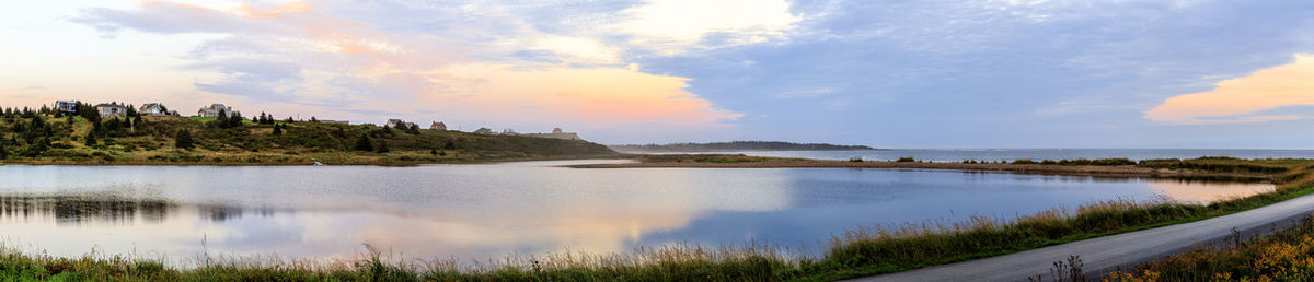 Panoramic view of lake against sky during sunset