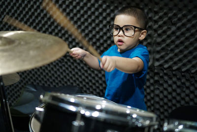 Boy playing drums