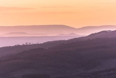 Scenic view of mountains against sky during sunset