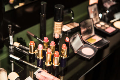 High angle view of make-up cosmetics on table