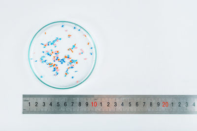 Microplastics in a petri dish, environmental science concept