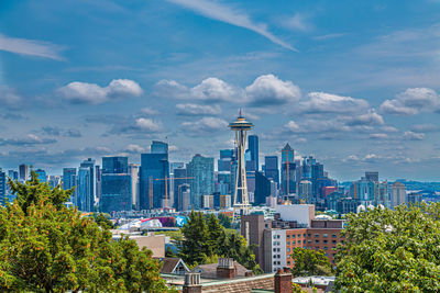 Modern buildings in city against sky