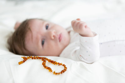 Cute baby lying on bed