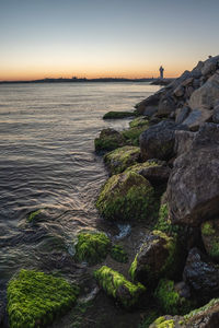 Scenic view of sea against clear sky during sunset