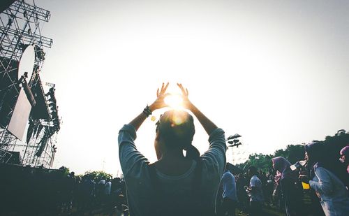Low angle view of sun against clear sky