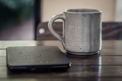 Close-up of coffee cup on table