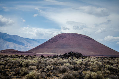 Scenic view of arid landscape against sky