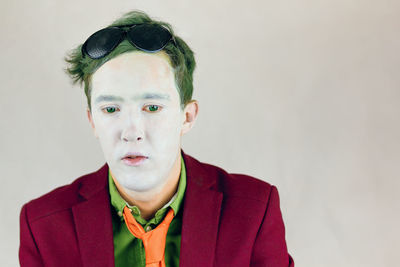 Portrait of young man against white background