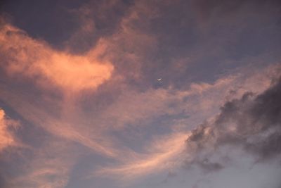 Low angle view of dramatic sky during sunset