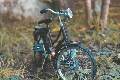 Close-up of bicycle toy on field