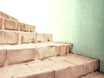Low angle view of empty seats on wall in building